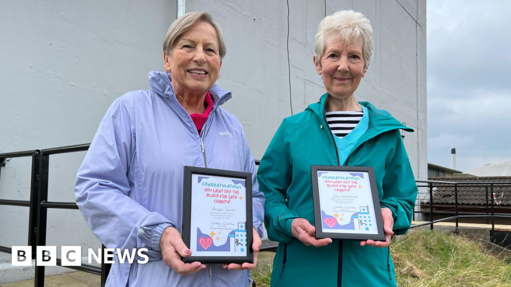 Friends in their 80s complete five-storey abseil