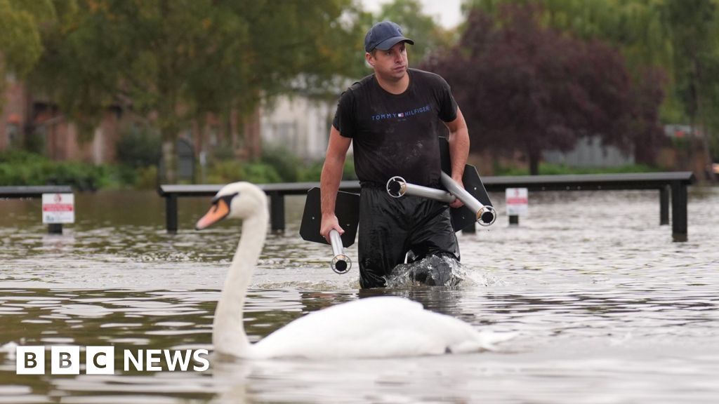 Cars and rail lines submerged as more rain forecast