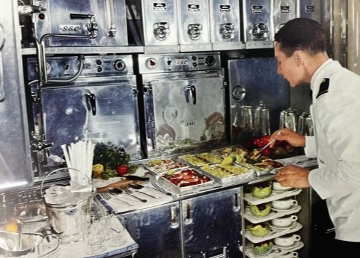 In the 50s, Flight attendants would prepare pre-cooked meals in the galley and heat them up in electric ovens