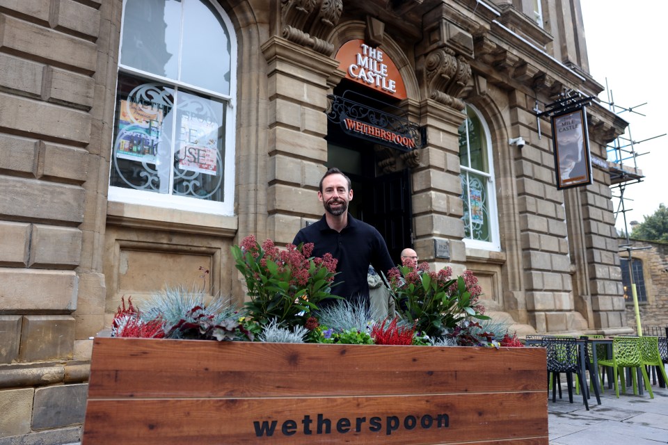 Bar manager Kris Lee outside the re-opened boozer