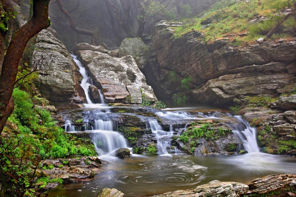 Dimosari Gorge in Evia offers stunning scenery with its waterfalls, rocky ravines, and lush green slopes