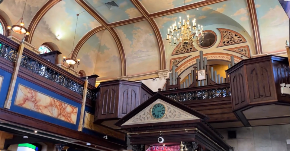 The painted ceiling and organ remain in place