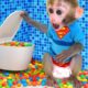 Monkey Baby Bon Bon meets rain of chocolate candy and eats rainbow milk bottle jelly with ducks