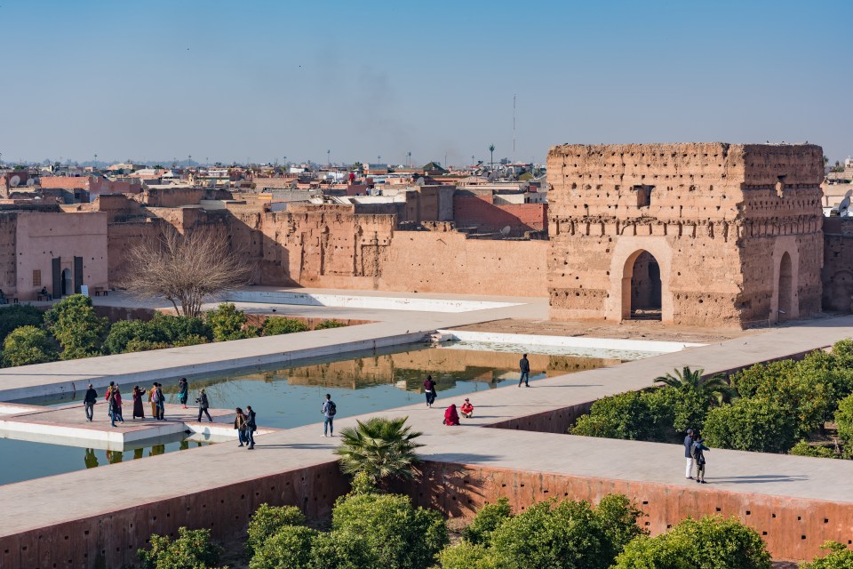 El Badi Palace features intricate mosaics and its rooftop has views of the Atlas Mountains