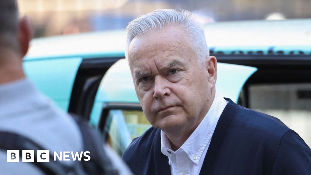 Silent Huw Edwards arrives at court