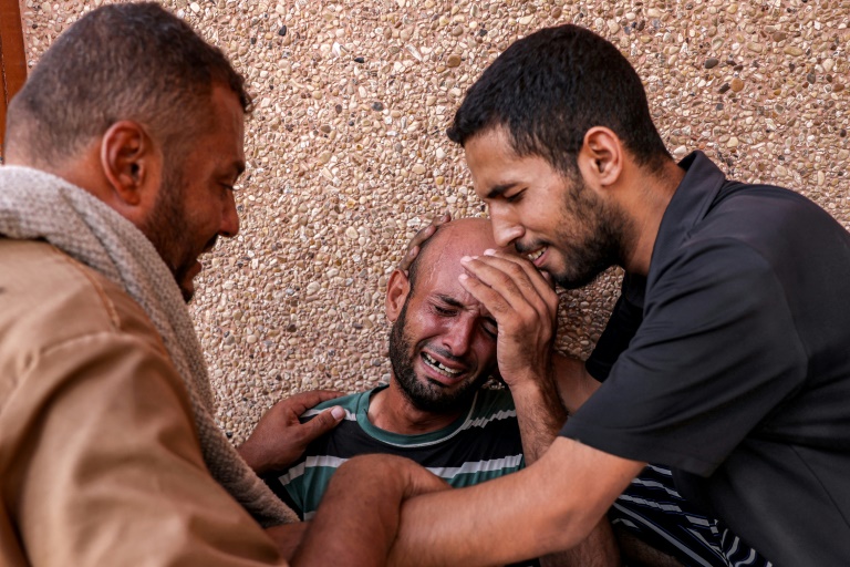 A Palestinian man mourning his son who was killed in Israeli bombardment in the southern Gaza Strip (Bashar TALEB)