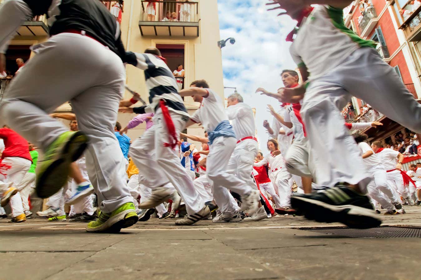 People run from bulls in Pamplona, Spain