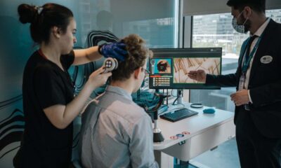 Members of the medical staff at the Elithair clinic conduct an artificial Intelligence analysis of Felix Hofmann