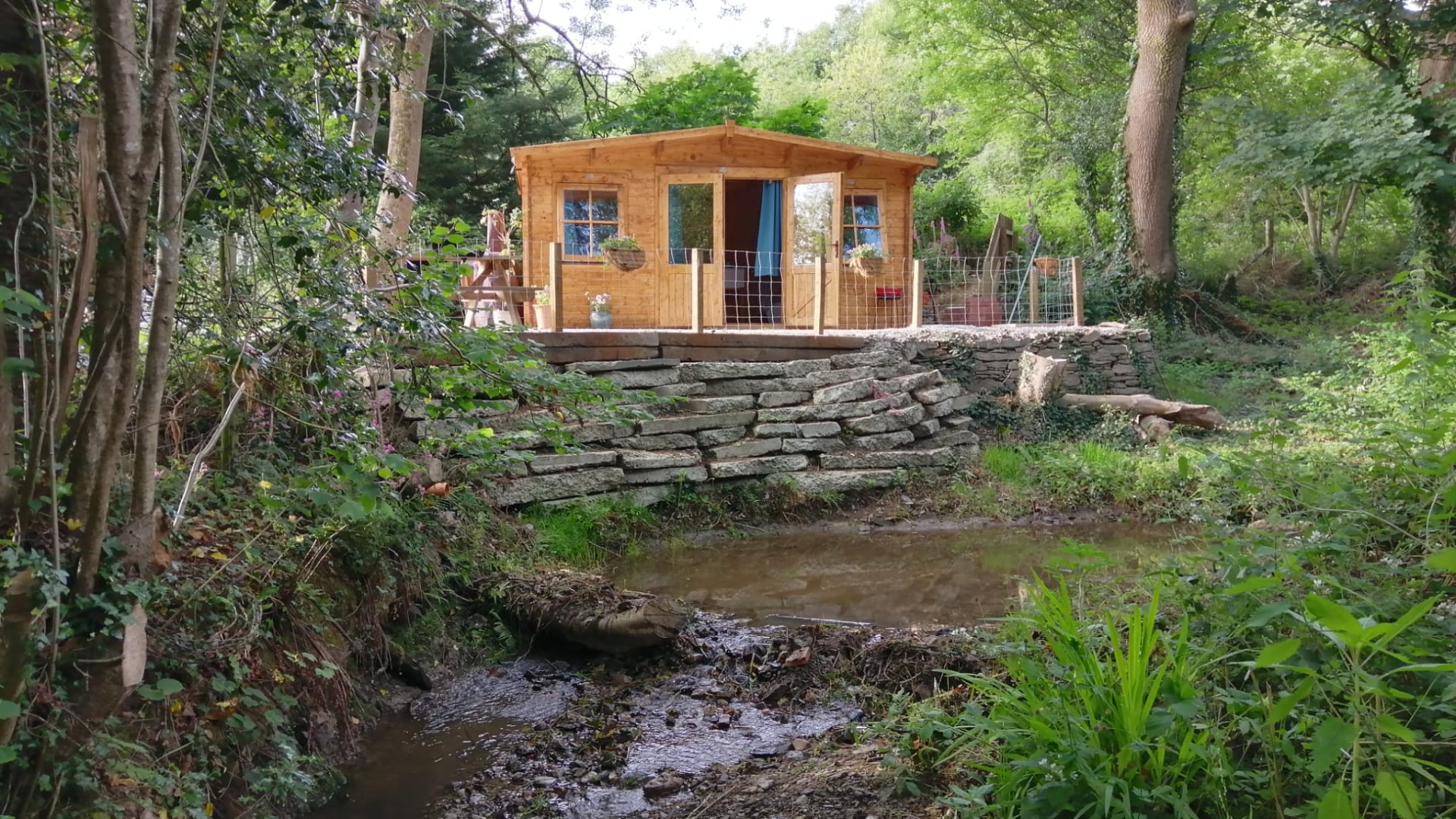 We rent luxury cabins on Airbnb but ‘sour grapes’ neighbours are trying to rip them down - one even helped us build them