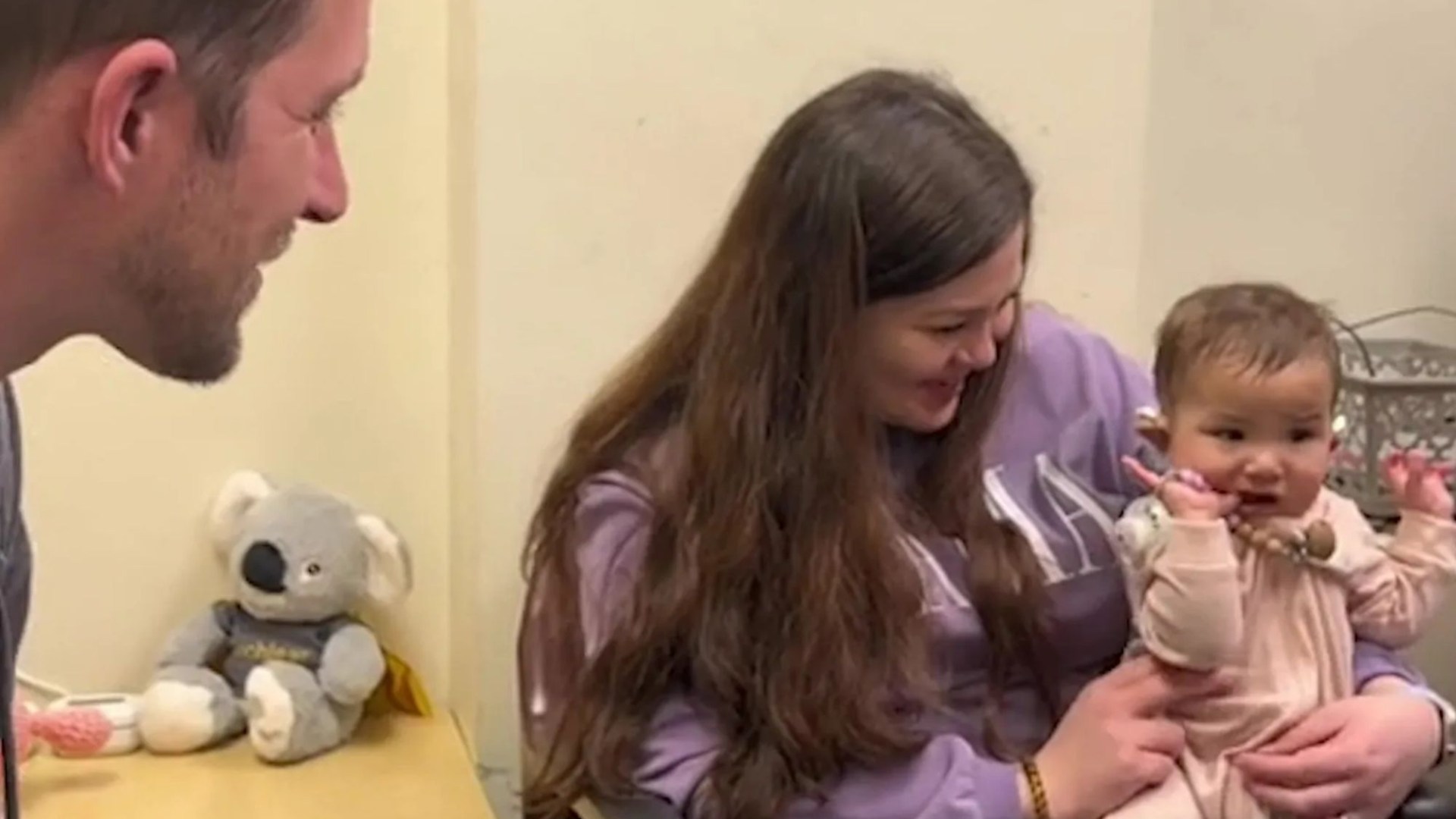 Adorable moment 'completely deaf' baby girl hears her dad's voice for the first time - leaving mum in tears