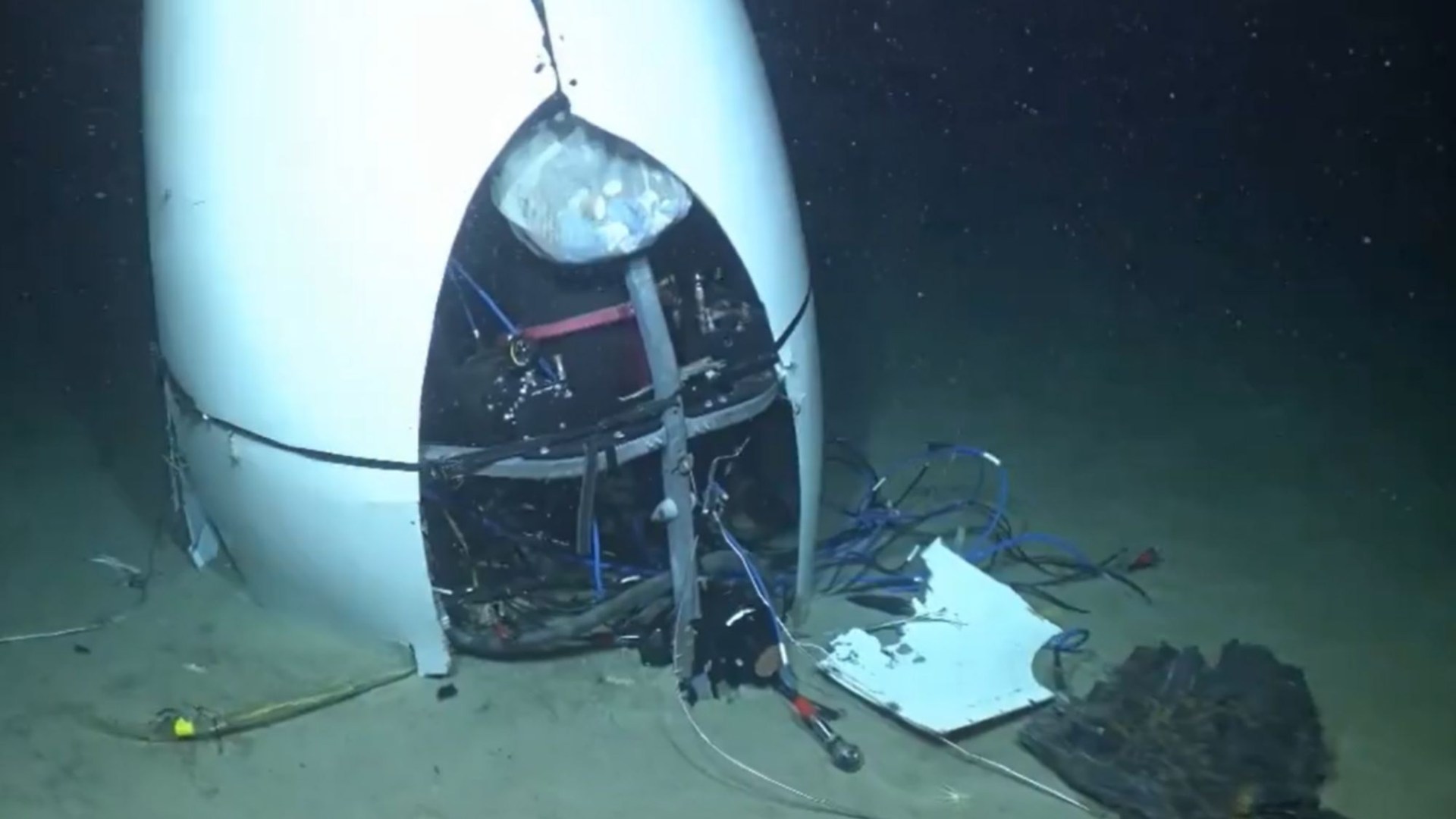 Chilling first video of doomed Titan submarine wreck shows mangled craft on ocean floor after devastating implosion