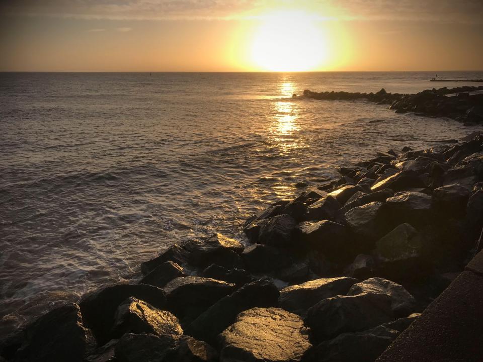 Holidaymakers flock to Ness Point to watch the sunrise before other parts of the country