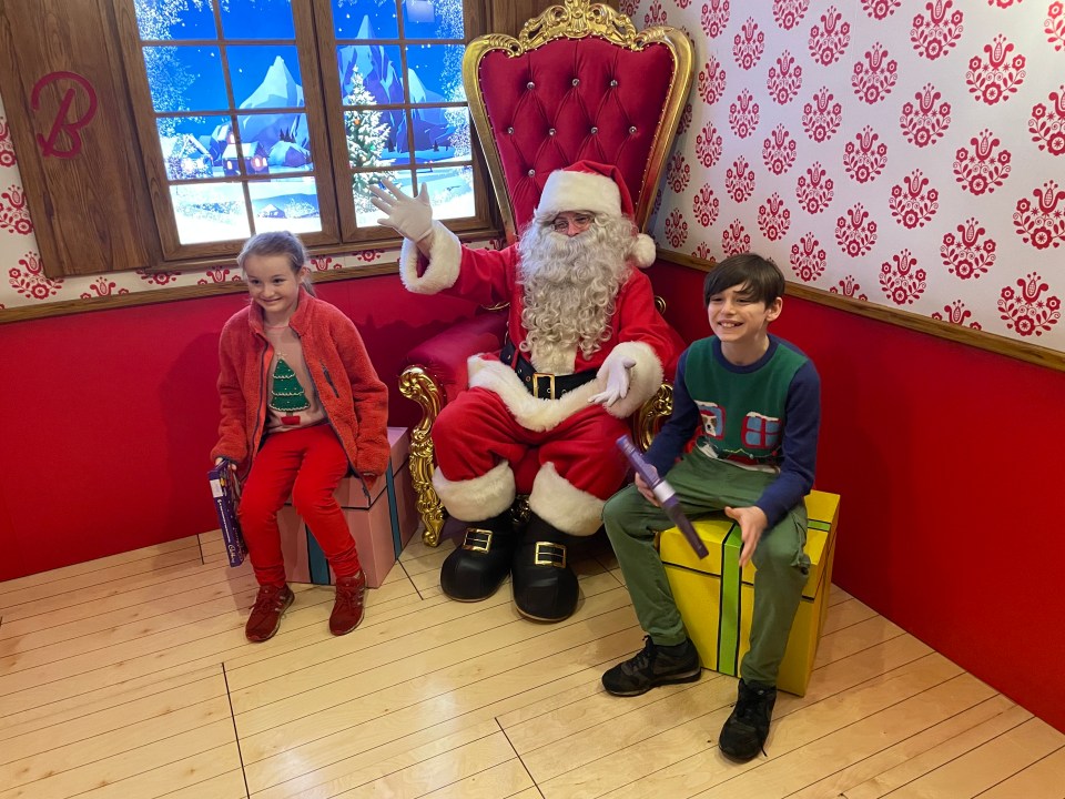 Luella and Harvey meeting Santa during their immersive grotto experience