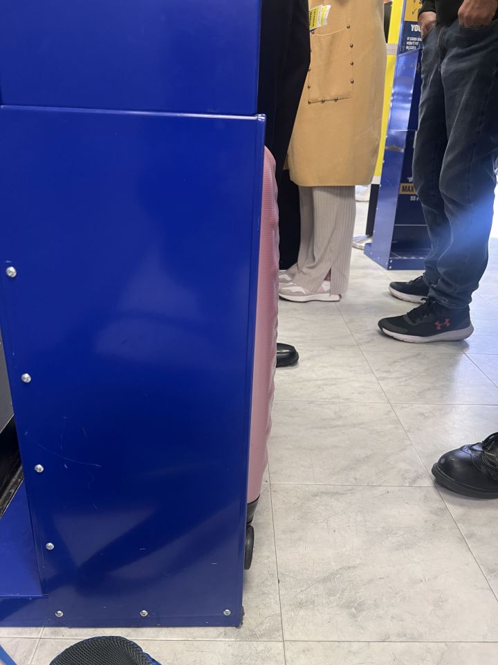 Her hand luggage didn't quite fit inside the size checker