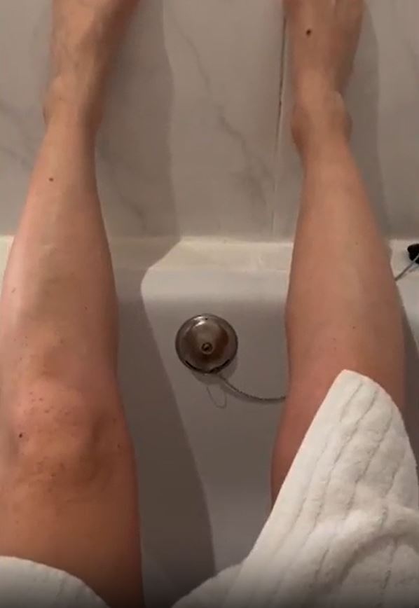 Inside the bathroom was a half-sized bath that she was unable to squeeze her legs into