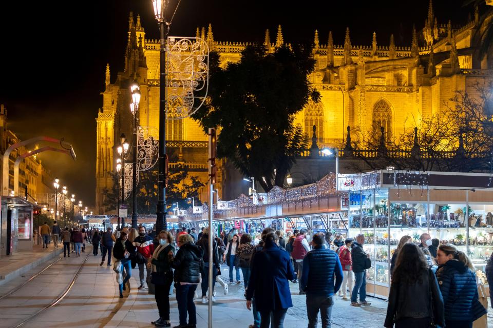 Visitors can snack on churros at Seville's market