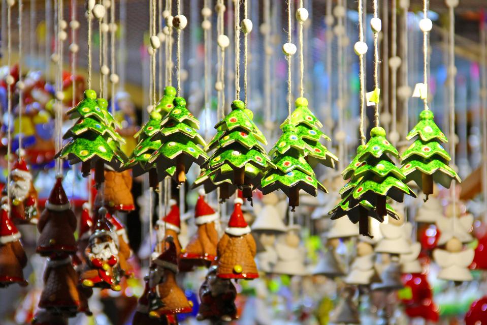 The market is filled with wooden stalls selling handmade gifts