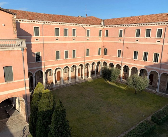 The Centro Culturale Don Orione Artigianelli, a pink-red-brick former monastery