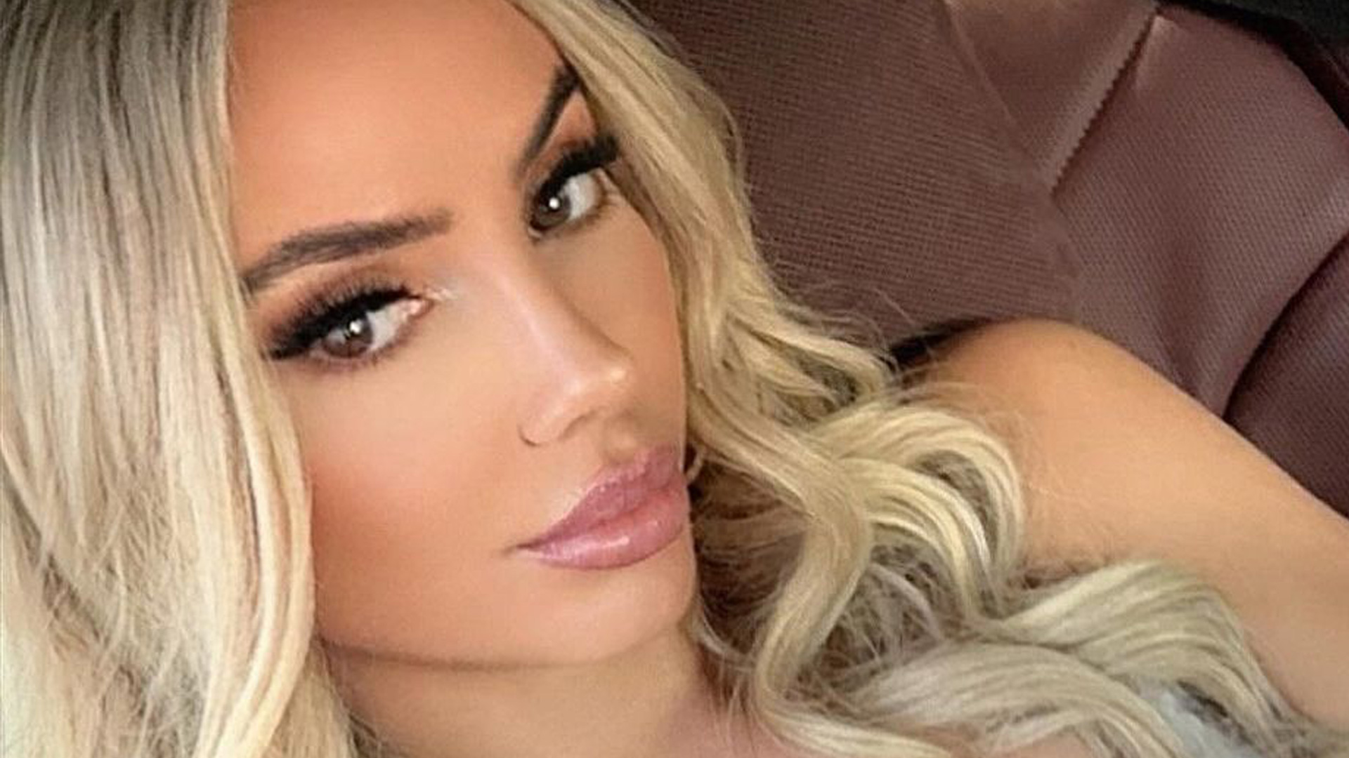 Footballer's mum who was mistaken for his glamorous Wag stuns in busty selfie leaving fans in disbelief