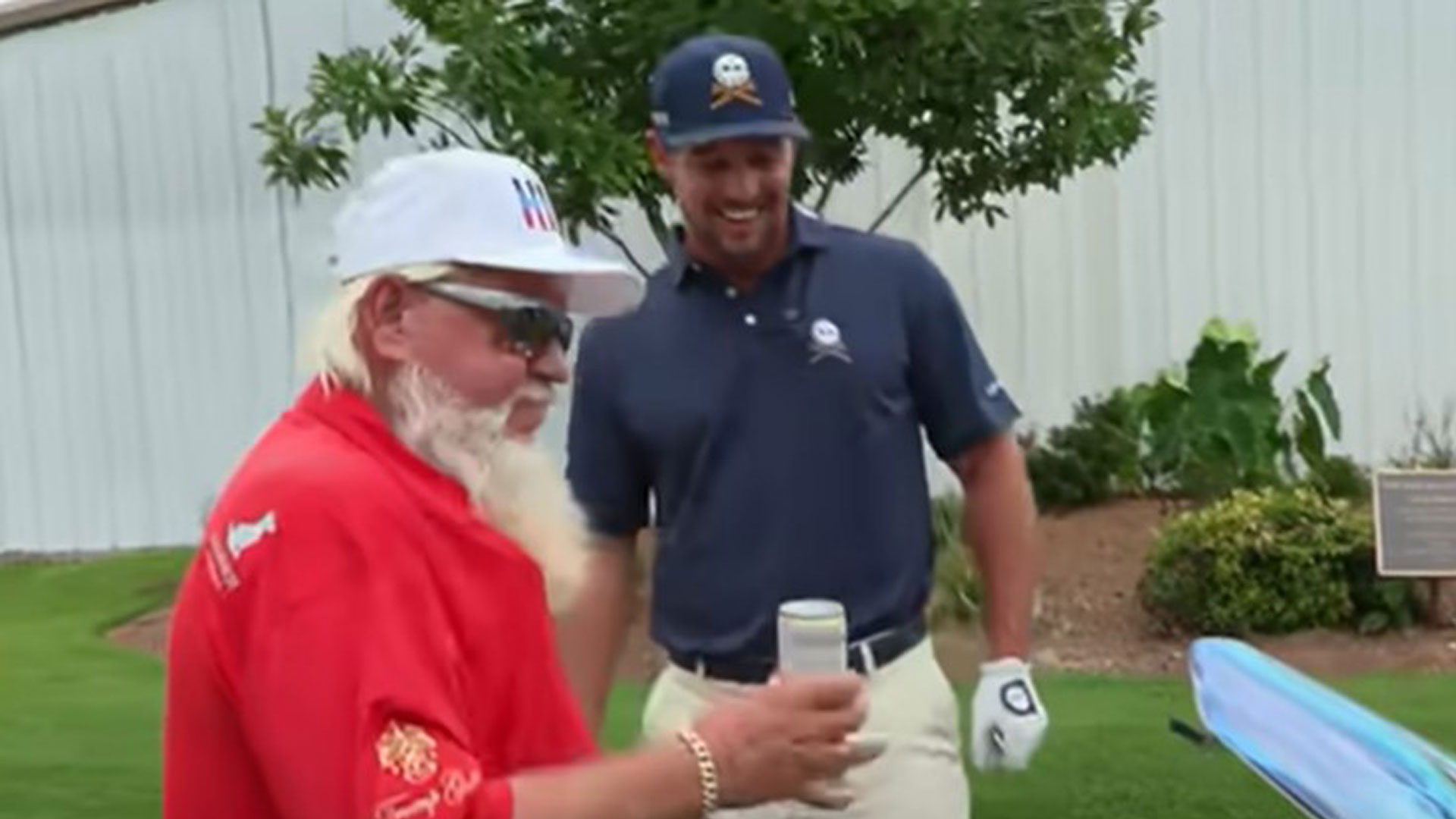 Golf legend John Daly leaves Bryson DeChambeau stunned as he shows off golf cart with built-in DRINKS COOLER