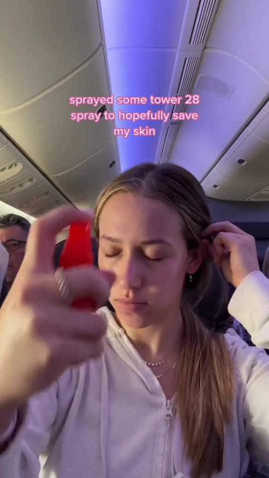 A Tiktoker is pictured carrying out her controversial routine whilst on a flight