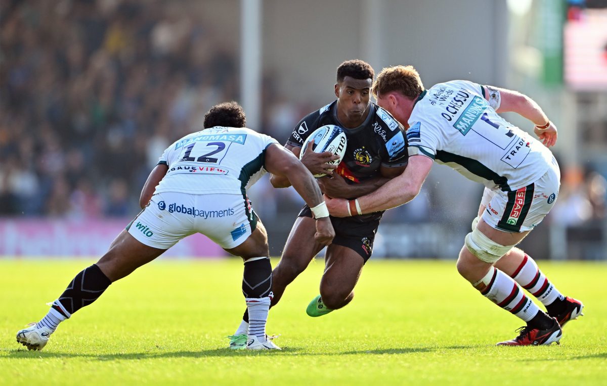 EXETER, ENGLAND - SEPTEMBER 22: Immanuel Feyi-Waboso of Exeter Chiefs is tackled by Solomone Kata and Ollie Chessum of Leicester Tigers during the Gallagher Premiership Rugby match between Exeter Chiefs and Leicester Tigers at Sandy Park on September 22, 2024 in Exeter, England. (Photo by Dan Mullan/Getty Images)