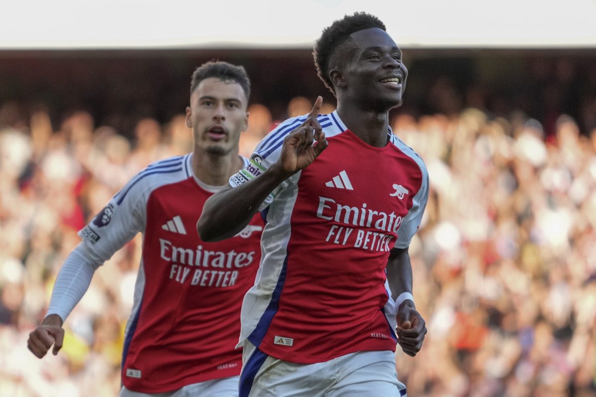 Arsenal's Bukayo Saka, right, celebrates after scoring his side's third goal during the English Premier League soccer match between Arsenal and Southampton at the Emirates Stadium in London, Saturday, Oct. 5, 2024. (AP Photo/Kirsty Wigglesworth)