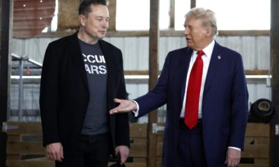 BUTLER, PENNSYLVANIA - OCTOBER 05: Republican presidential nominee, former President Donald Trump offers his hand to Elon Musk back stage during a campaign rally at the Butler Farm Show grounds on October 05, 2024 in Butler, Pennsylvania. This is the first time that Trump has returned to Butler since he was injured during an attempted assassination on July 13. (Photo by Anna Moneymaker/Getty Images)