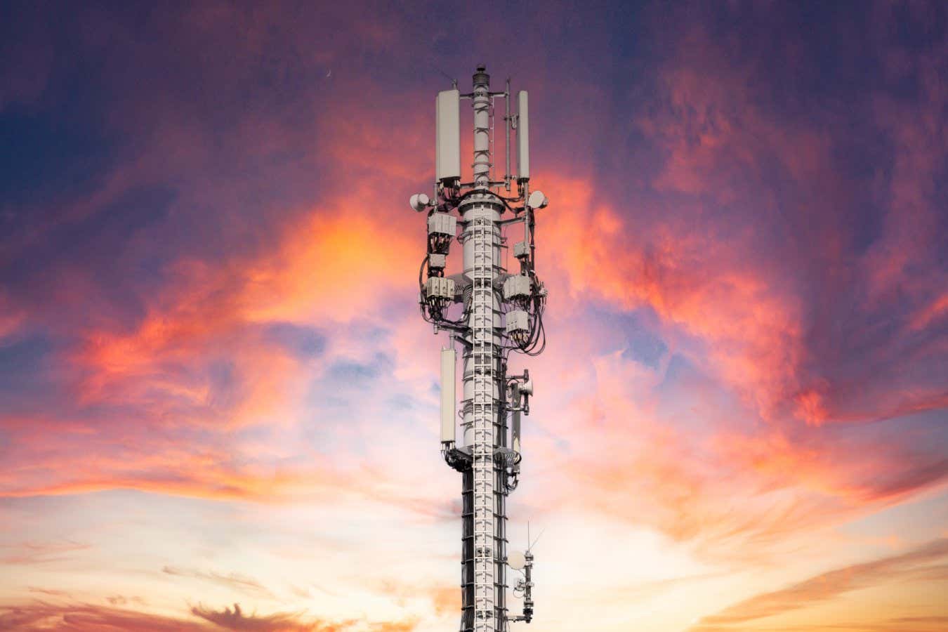 Mobile phone antenna station at sunset