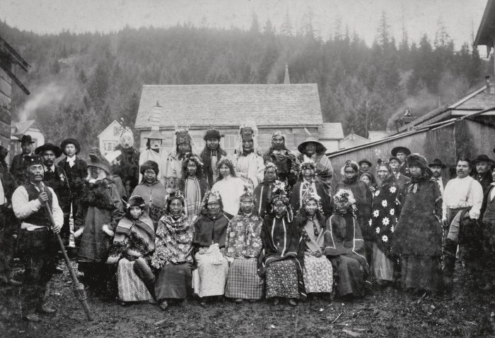 The 1876 photograph of Haida women in clan regalia at HIGaagilda