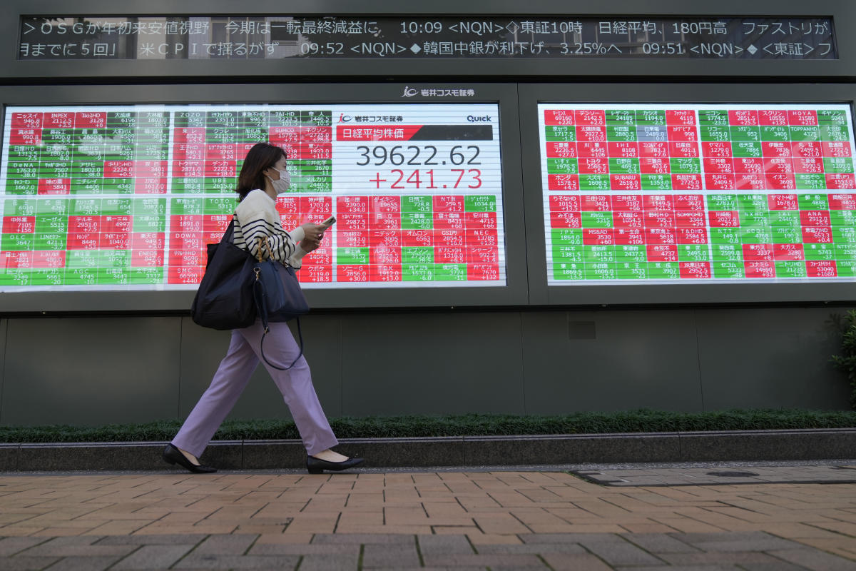 Asian shares are mostly higher after Wall St powers to more records