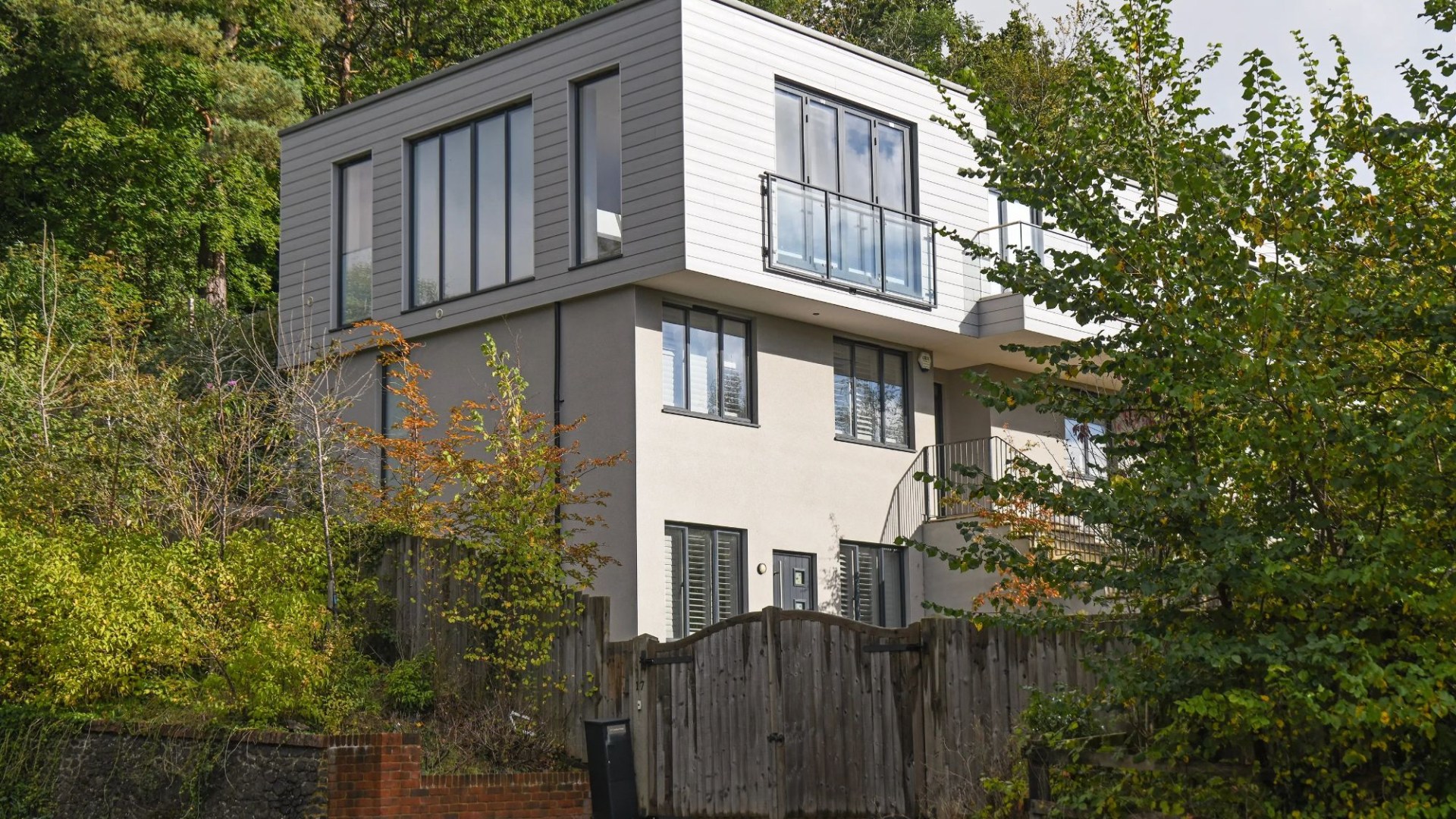 Neighbours at war over Grand Designs-style clifftop ‘EYESORE’ which ‘looks like a big pile of shipping containers’