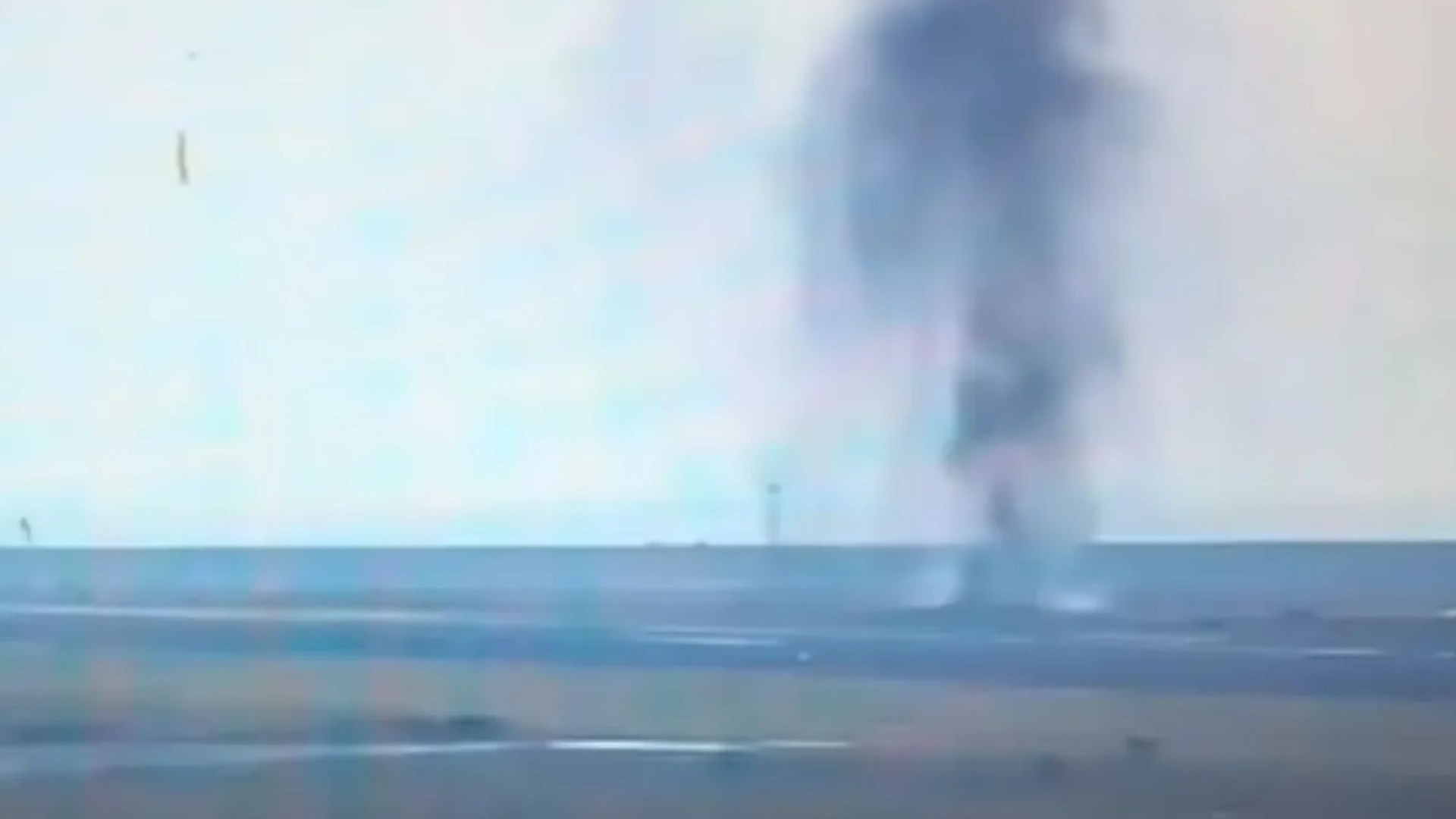 Shocking moment US World War 2 bomb explodes on runway at Japanese airport - leaving huge crater as flights halted