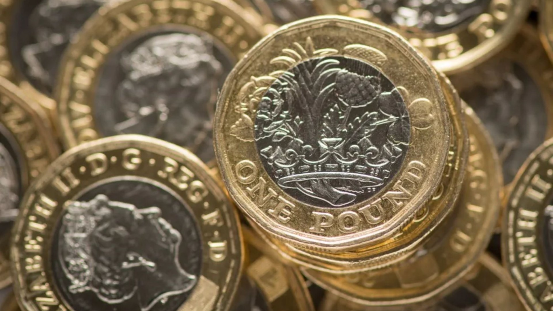 Tiny clue on edge of £1 coin that makes it worth 2500 times its face value - do you have one lurking in your change?