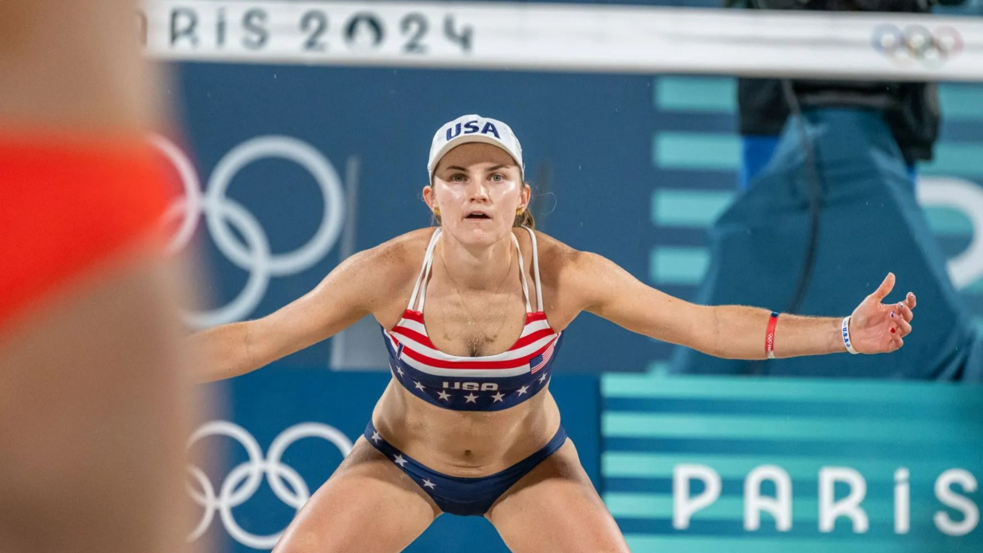 Who is Taryn Kloth's Olympic beach volleyball partner Kristen Nuss and how many tour titles have they won?