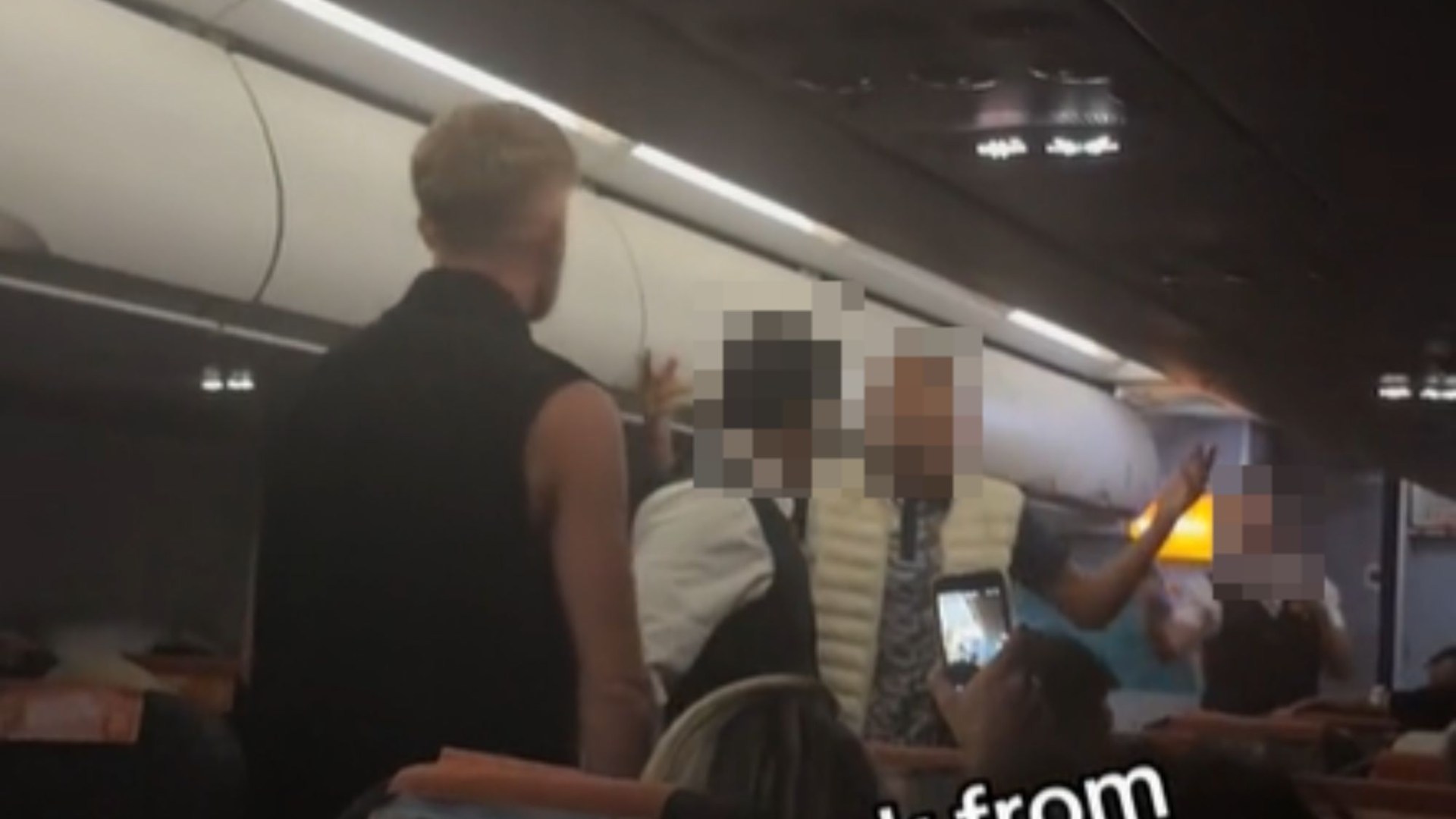 Moment ‘drunk’ easyJet passengers square off for midair brawl in aisle as captain pleads ‘you’re making things worse’