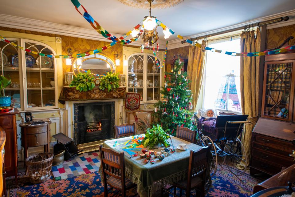 Rooms inside the replica buildings are decorated with retro Christmas decorations like paper chains