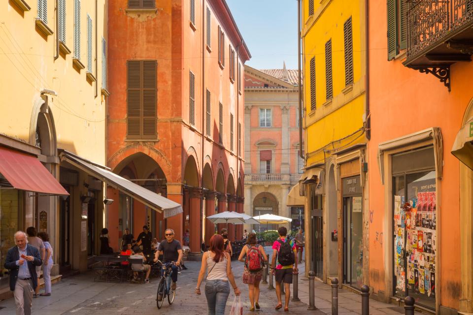 The buildings in Bologna are painted in various shades of orange, red and yellow, making them a tourist attraction in their own right