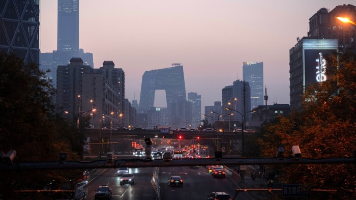 The CCTV Tower and surrounding buildings in Beijing, China, at dusk.