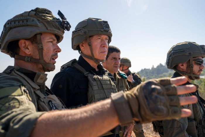 On October 13, Israeli Defence Minister Yoav Gallant, centre, visited an observation post overseeing southern Lebanon