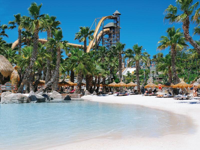 The Italian water park has been compared to the Caribbean because of its white sand beaches, palm trees and cabanas