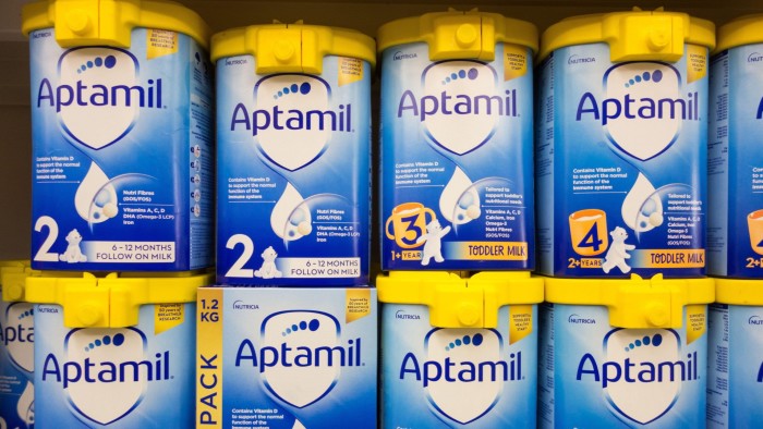 Cartons of Aptamil baby formula on a supermarket shelf