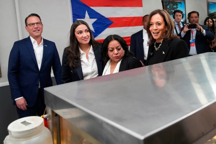 Kamala Harris with local restaurant owner Diana de La Rosa, representative Alexandria Ocasio-Cortez and governor Josh Shapiro during a campaign stop in Reading, Pennsylvania, on Monday