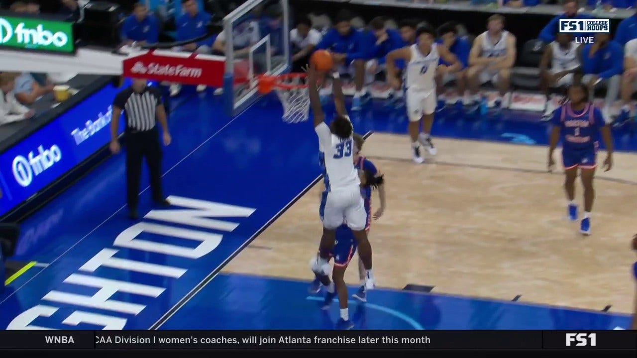 Fredrick King soars for a strong two-handed alley-oop to extend No. 14 Creighton