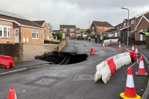 Residents can go home for Christmas after huge 60ft-deep sinkhole opened up on street