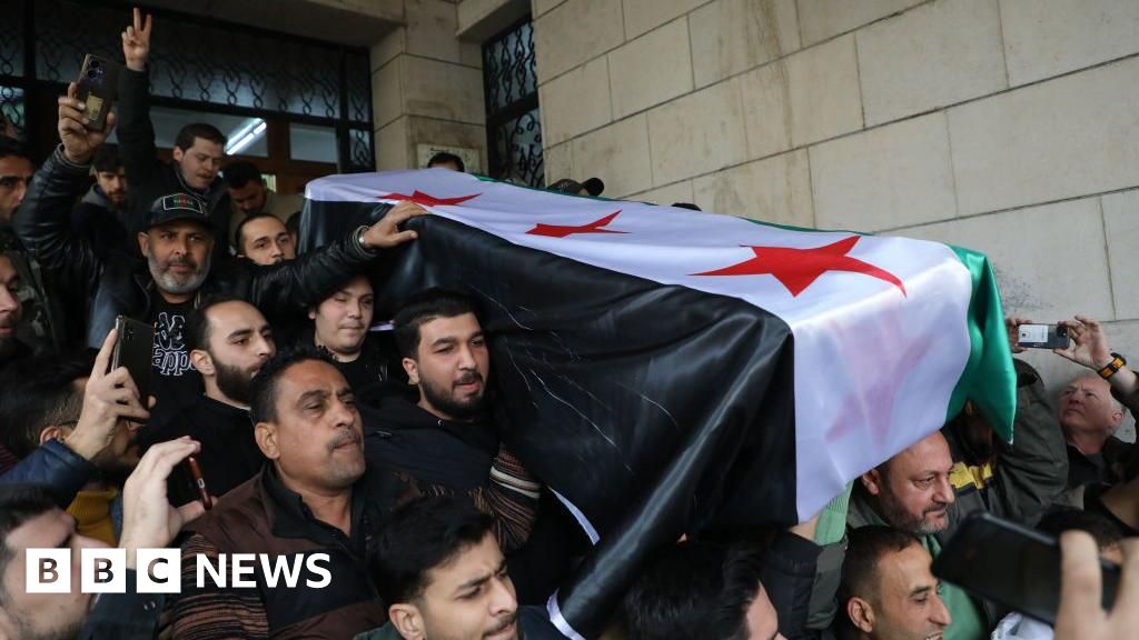 'I wish he'd lived to see new Syria': Crowds bury anti-Assad activist