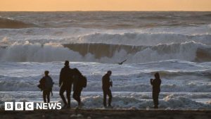 Winter winds bring deadly surf conditions and tornadoes to US