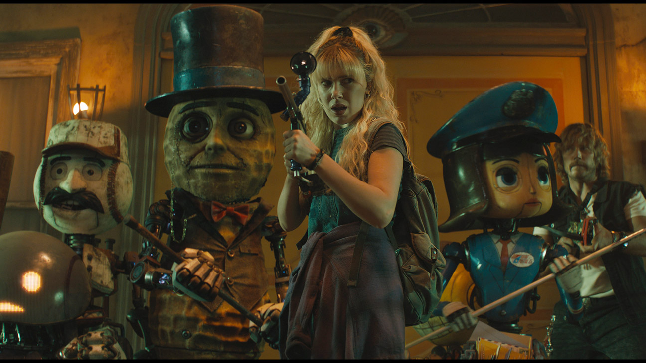 (L to R) Herman (voiced by Anthony Mackie), PopFly (voiced by Brian Cox), Mr. Peanut (voiced by Woody Harrelson), Michelle (Millie Bobby Brown), Penny Pal (voiced by Jenny Slate) and Keats (Chris Pratt) in The Electric State.