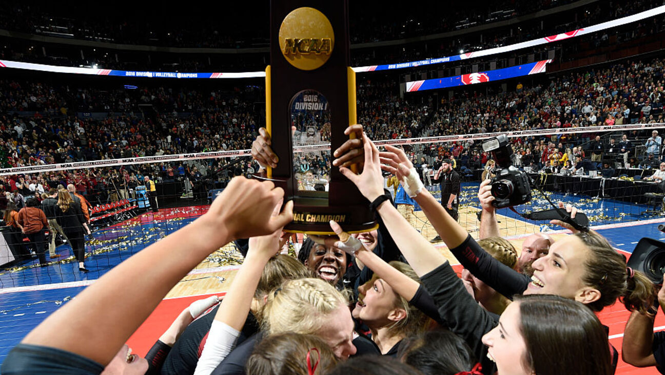 COLUMBUS, OH - DECEMBER 17: Stanford players raisethe trophy after beating Texas in the Division I Women's Volleyball Championship held at Nationwide Arena on December 17, 2016 in Columbus, Ohio. Stanford beat Texas 3 sets to 1 to win the championship. (Photo by Jamie Schwaberow/NCAA Photos via Getty Images)