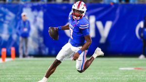 CHARLOTTE, NORTH CAROLINA - DECEMBER 07: Kevin Jennings #7 of the Southern Methodist Mustangs runs the ball during the first half of the ACC Championship game against the Clemson Tigers at Bank of America Stadium on December 07, 2024 in Charlotte, North Carolina. (Photo by David Jensen/Getty Images)